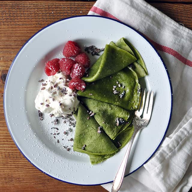 Matcha Crepes with Whipped Cream, Berries, and Cacao Nibs