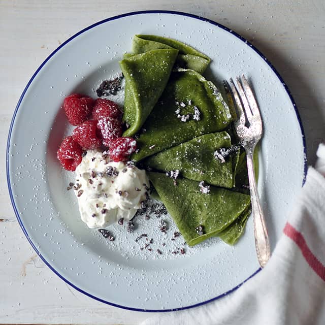 Matcha Crepes with Whipped Cream, Berries, and Cacao Nibs