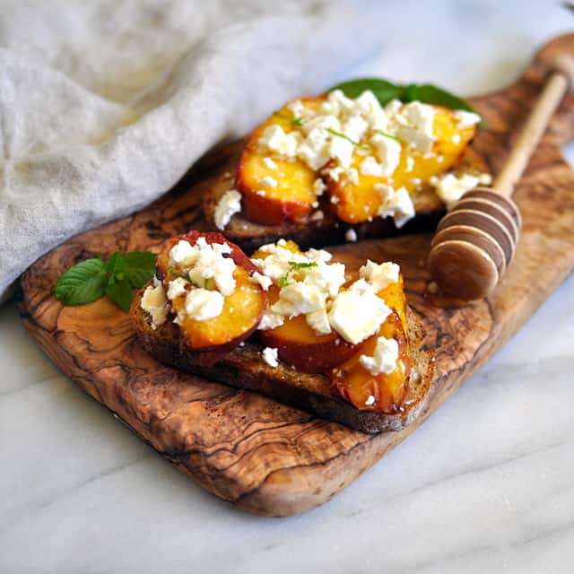 Grilled Peach Crostini with Feta and Fir Honey 
