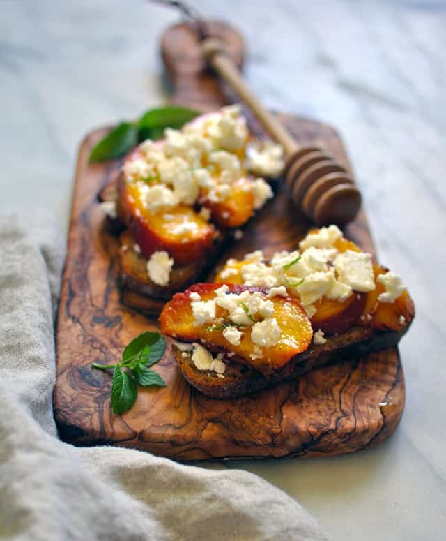 Grilled Peach Crostini with Feta and Fir Honey