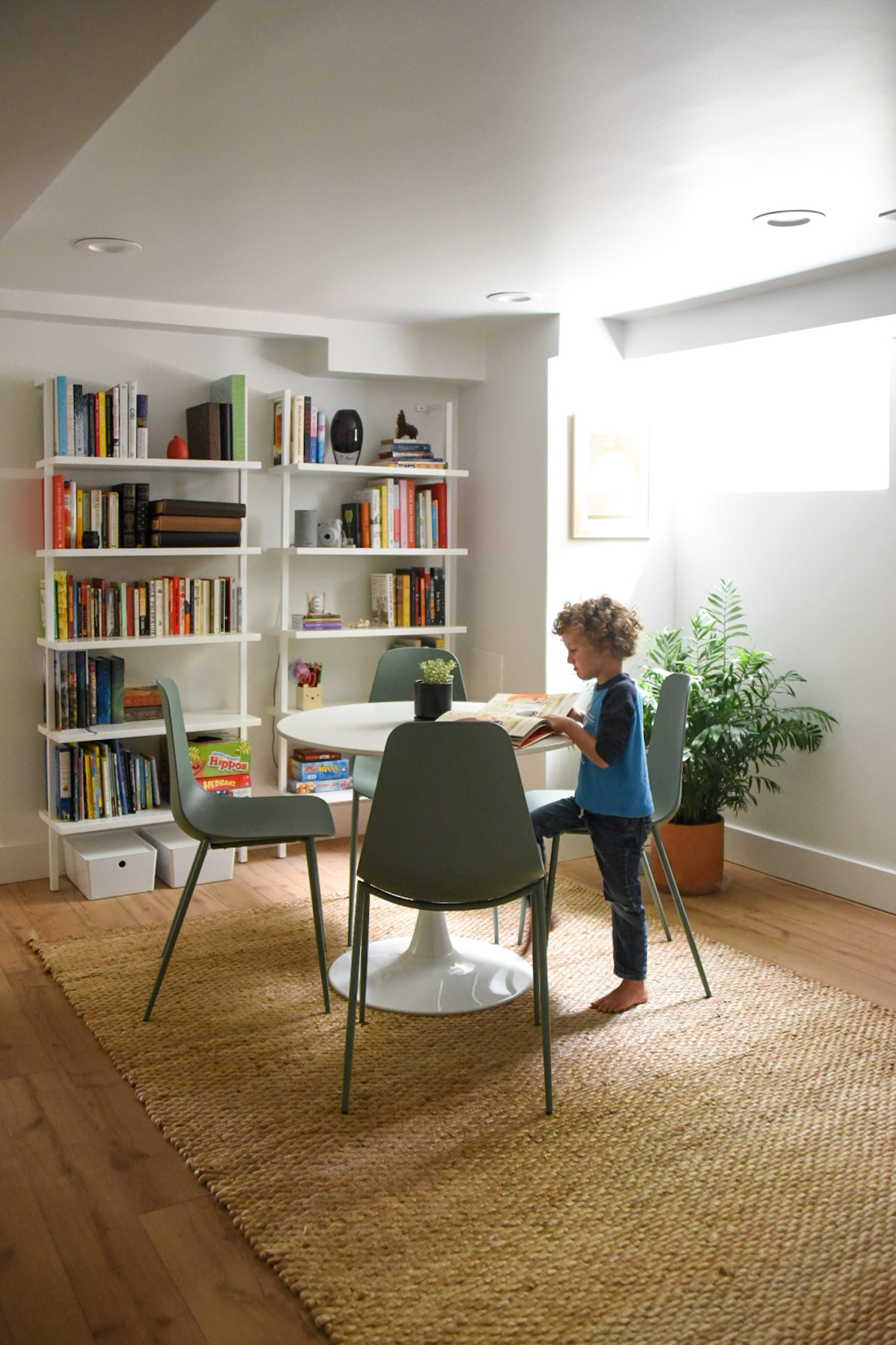 How a Seattle family of five turned a dark family basement in their 1930s tudor into a bright and airy multi-purpose workspace and playroom (with a cozy under stair reading nook!). 