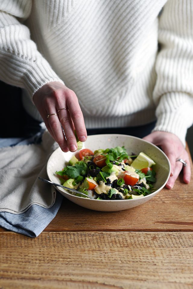 Turntable Kitchen shares a recipe for vegetarian (and vegan) Burrito Bowls with Cumin Lime Crema from A Couple Cook's new cookbook