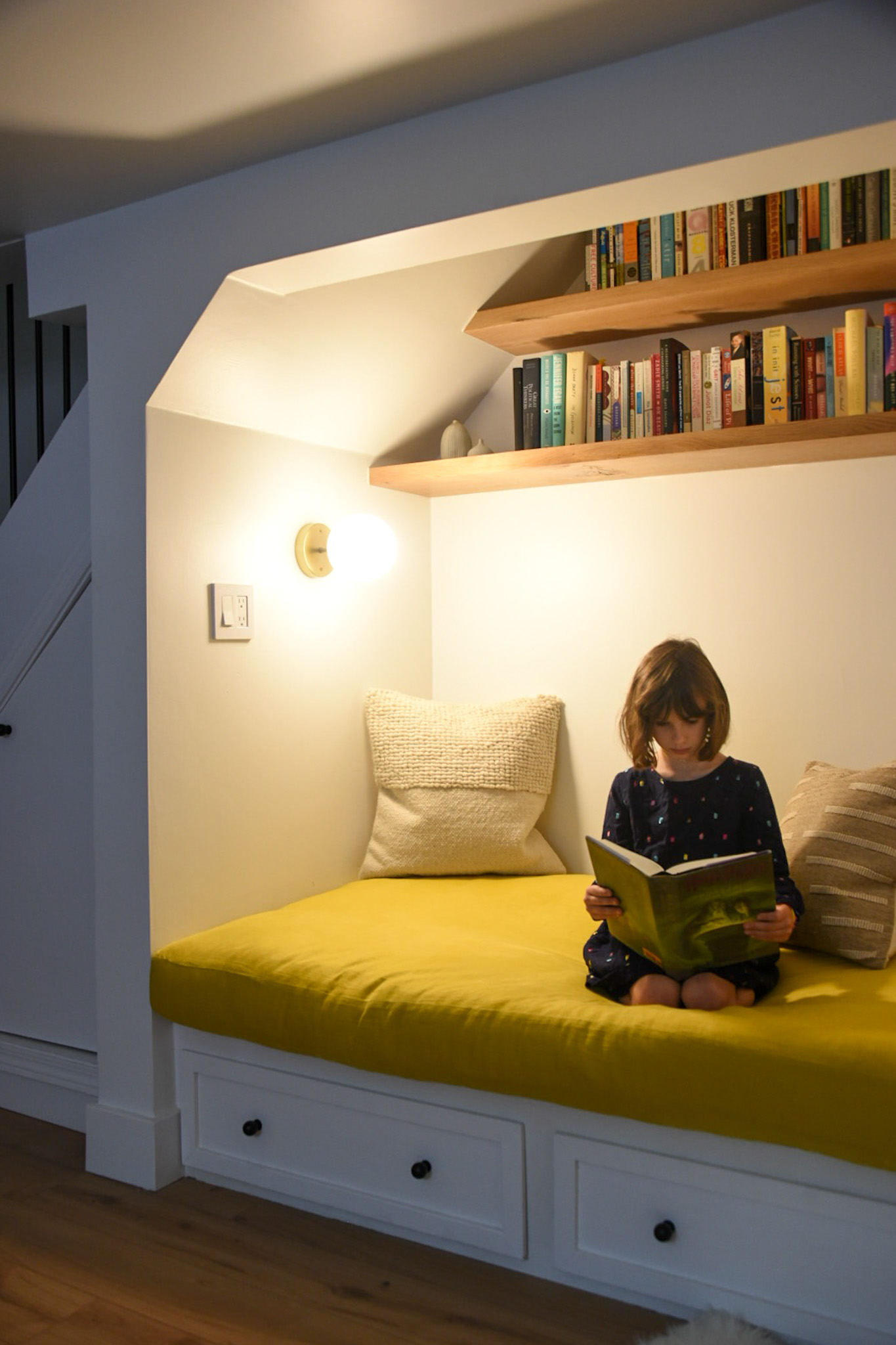 How a Seattle family of five turned a dark family basement in their 1930s tudor into a bright and airy multi-purpose workspace and playroom (with a cozy under stair reading nook!). 