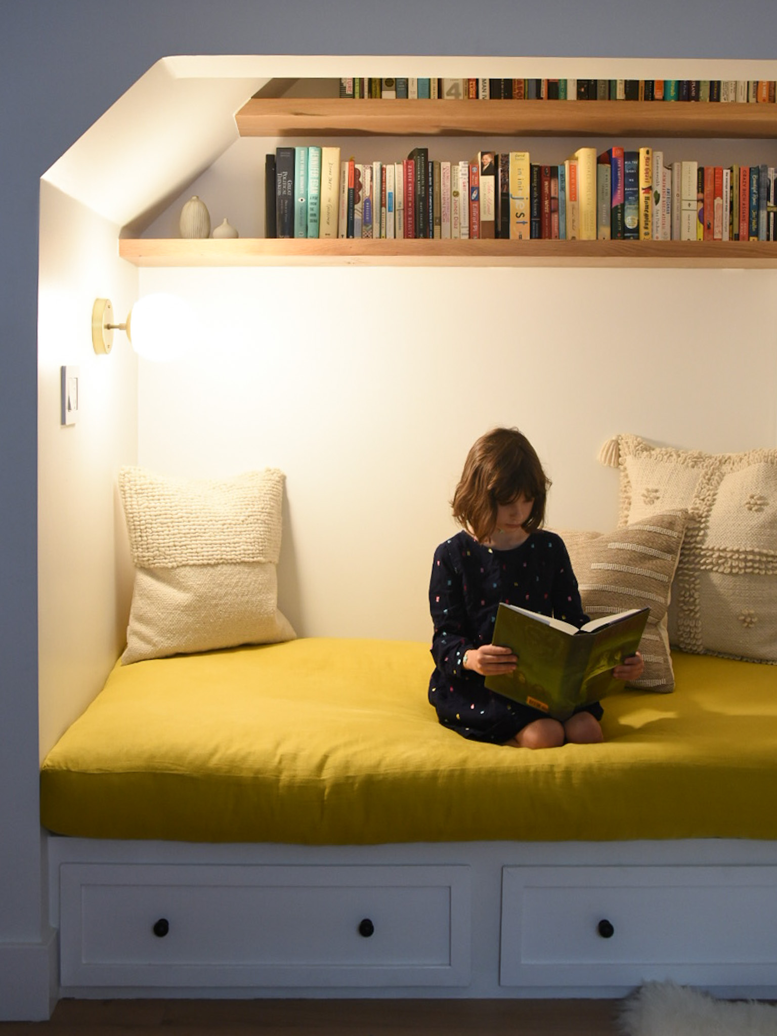 How a Seattle family of five turned a dark family basement in their 1930s tudor into a bright and airy multi-purpose workspace and playroom (with a cozy under stair reading nook!). 