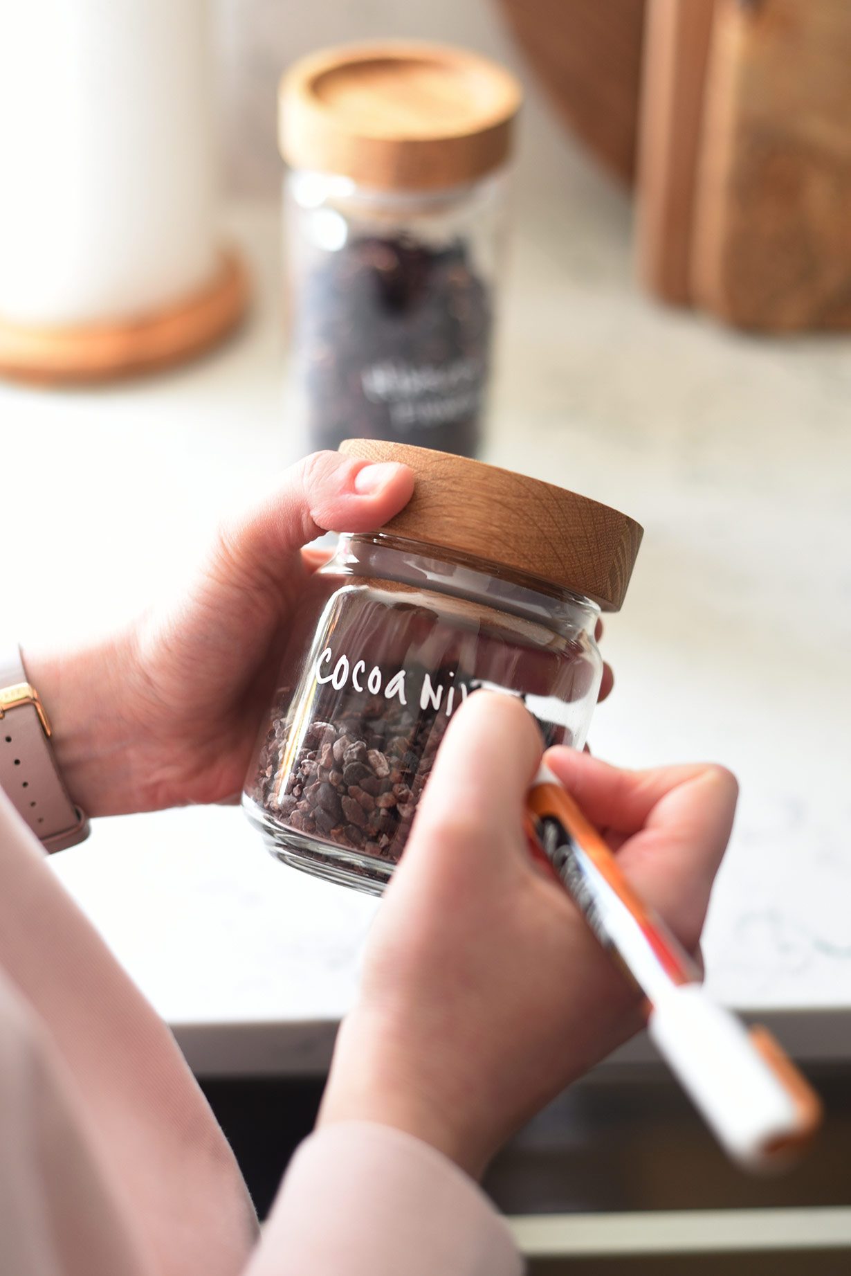 How to organize a deep shelf pantry: label glass jars with chalkboard marker so you can switch up ingredients.