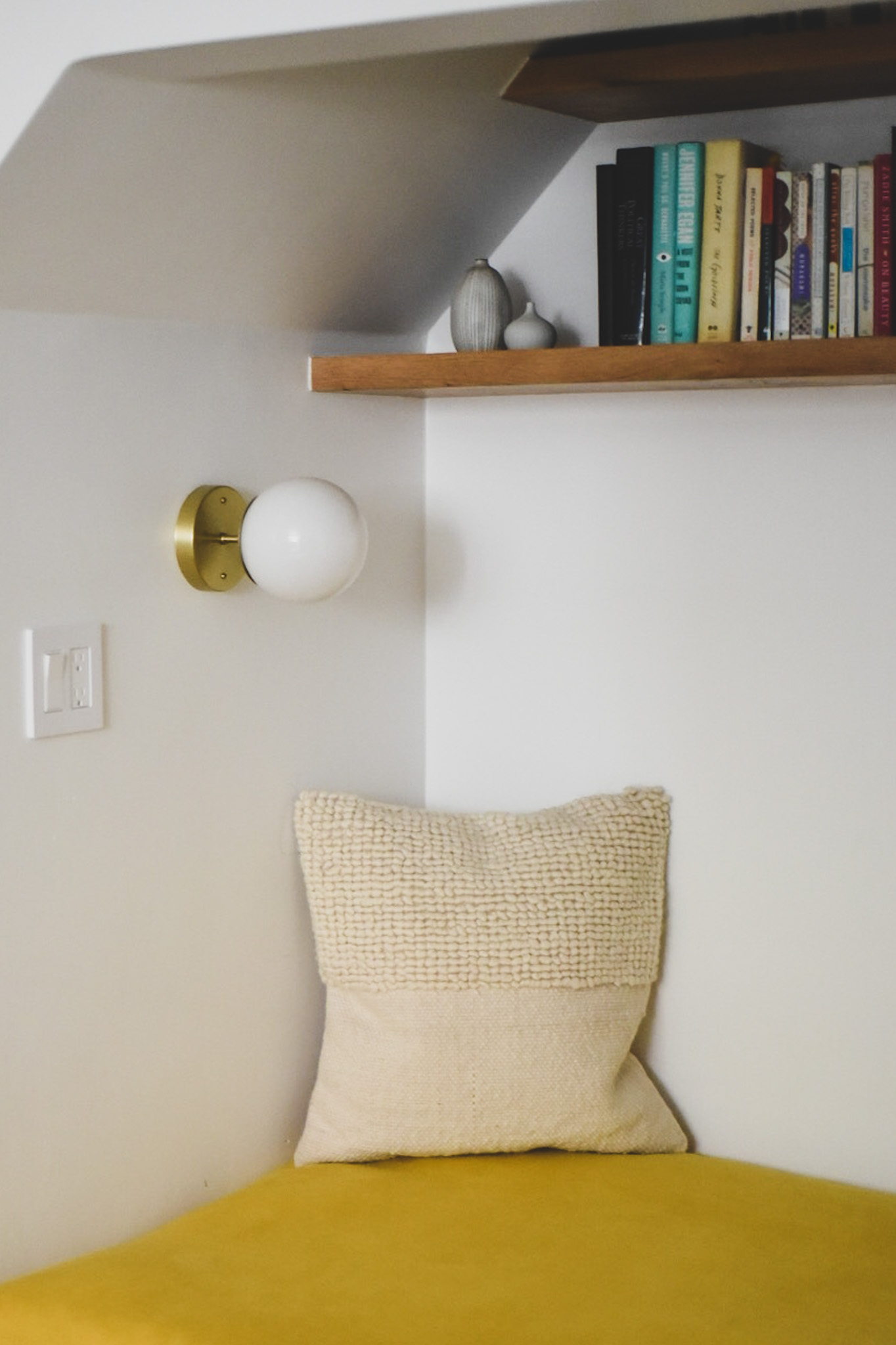 Schoolhouse Electric sconce in reading nook