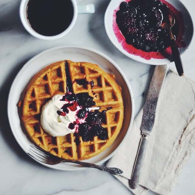 Whole Wheat Belgian Waffles with Cooked Berries and Whipped Cream