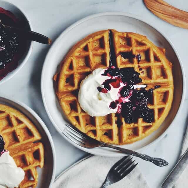 Whole Wheat Belgian Waffles with Cooked Berries and Whipped Cream